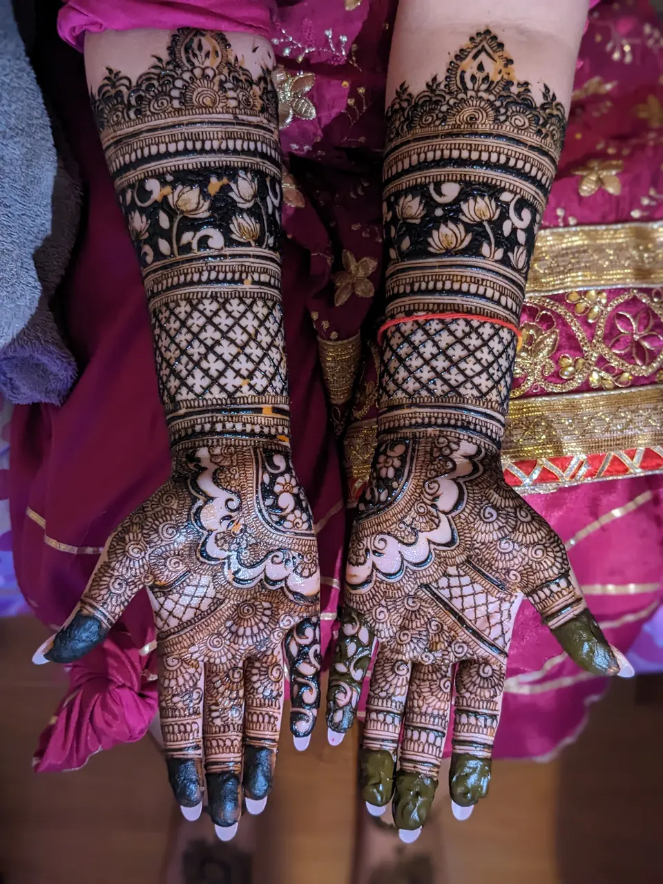 Bridal mehndi with lotus flowers and fine net patterns